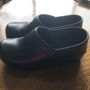 Black leather clogs